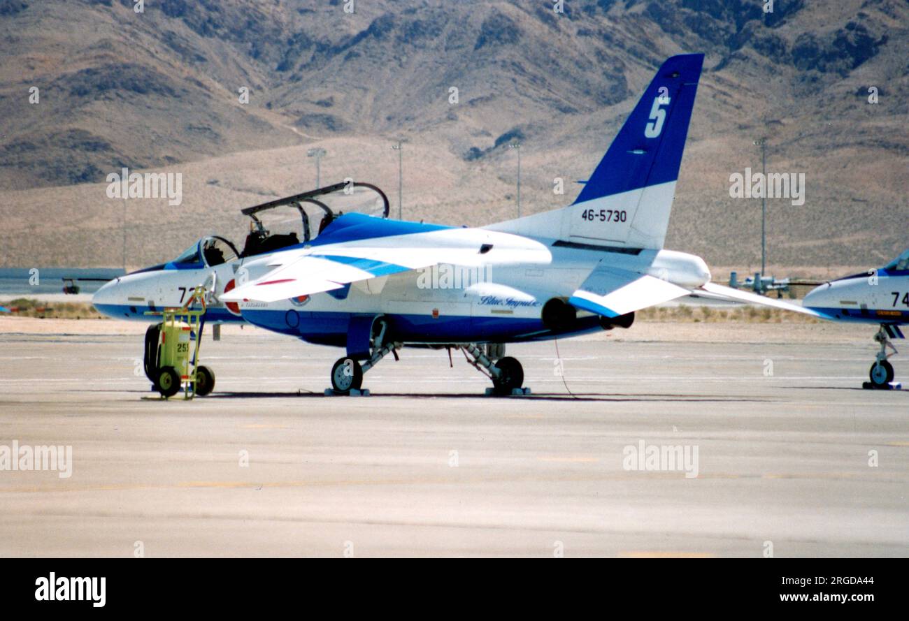 Japan Air Self Defence Force - Kawasaki T-4 46-5730 / number 5 (msn 1130), of the Blue Impulse aerobatic display team, at the Nellis Air Force Base '50th Anniversary of the USAF' airshow on 26 April 1997. Stock Photo