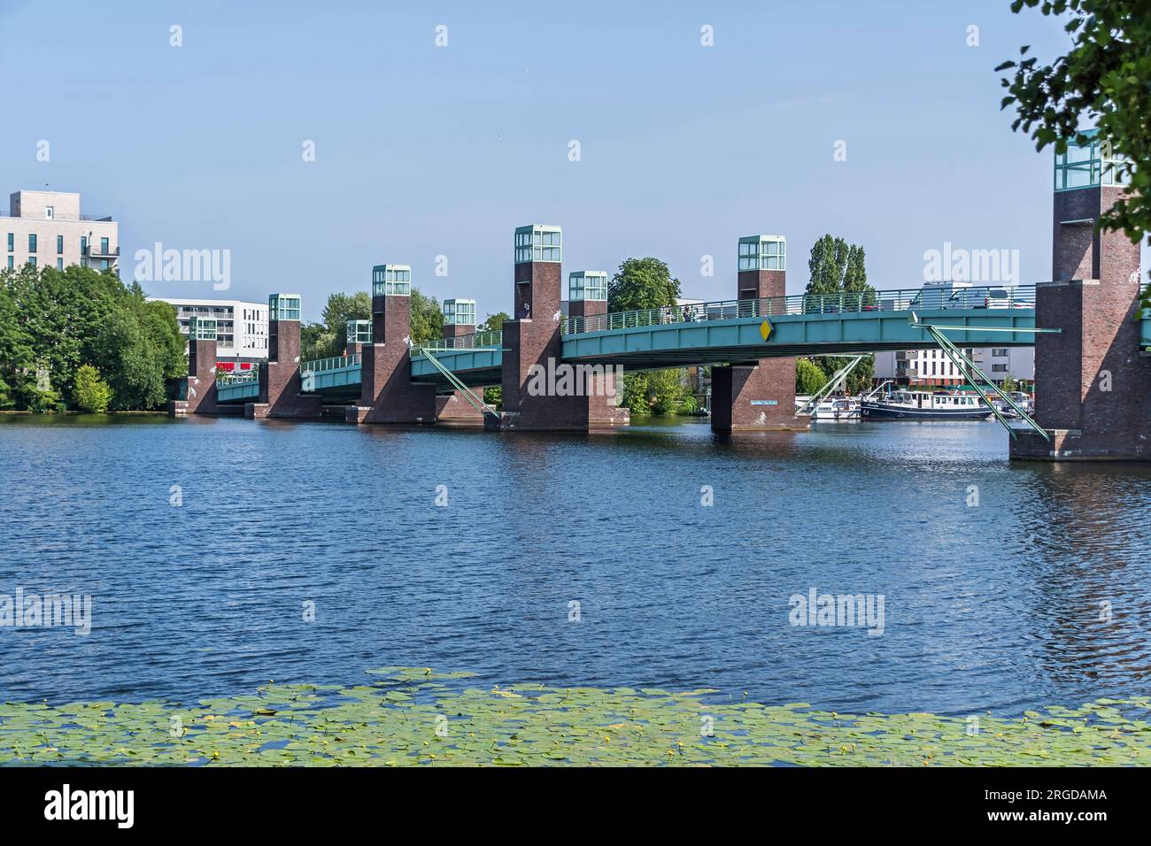Berlin, Germany - June 13, 2023: Steel girder bridge Spandauer-See Bruecke over the River Havel connects the parts of the Wasserstadt Oberhavel, which Stock Photo