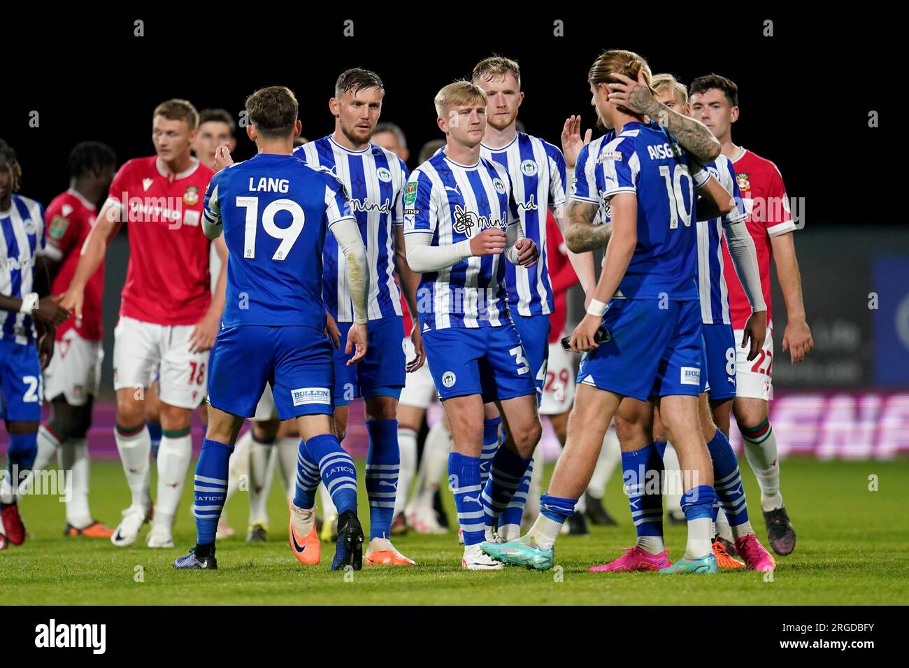 Wigan Athletic’s Thelo Aasgaard is consoled by his team mates after missing in the penalty shoot out during the Carabao Cup first round match at SToK Racecourse, Wrexham. Picture date: Tuesday August 8, 2023. Stock Photo