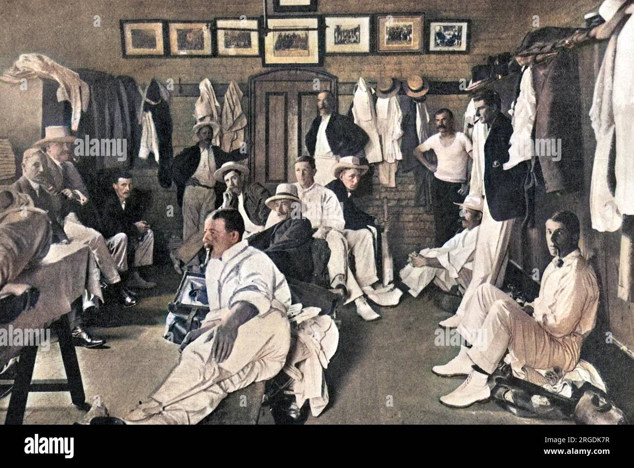The Australian eleven in their dressing room on the Melbourne cricket ground.  In the right hand corner of the picture is C. Hill smoking a pipe.  Other players are M. A. Noble, W.P. Howell, R.A. Duff, C. McLeod, S.Gregory, J.J. Kelly and W.W. Armstrong. Stock Photo