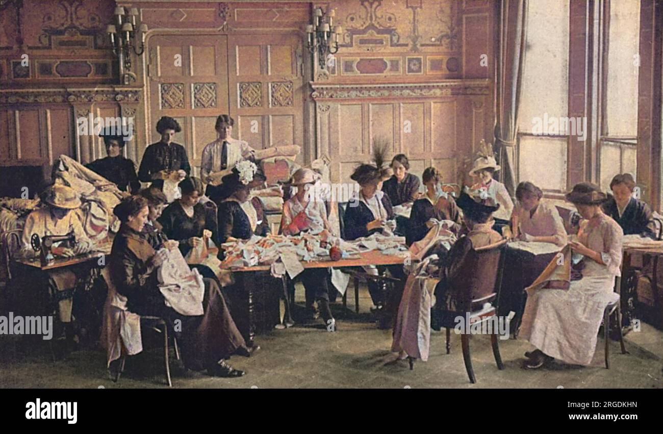 In a London hotel, ladies working for Queen Mary's Needlework Guild make clothes for front line soldiers. Stock Photo
