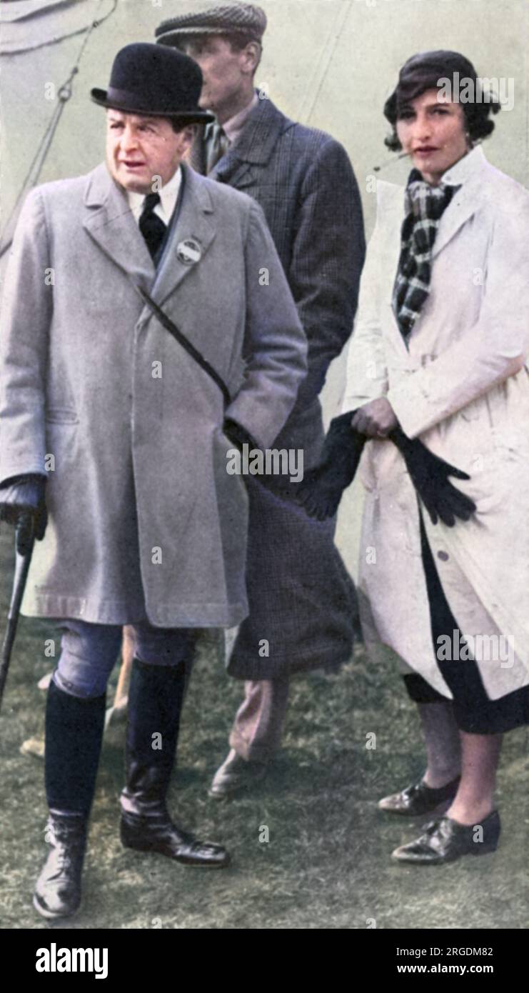 Admiral Lord Beatty and Mrs Ronald Tree (better known now as Nancy Lancaster) at the Woodland Pytchley Hunt. Nancy Lancaster (1897 - 1994), nee Perkins, was an influential American-born tastemaker, interior decorator and garden designer. She married Ronald Tree (joint master of the Pytchley hunt and later MP for Harborough) in 1920, moving to Britain in 1927; the couple divorced in 1947 and she married Claude Lancaster in 1948. She was associated with the English Country House Style. Stock Photo