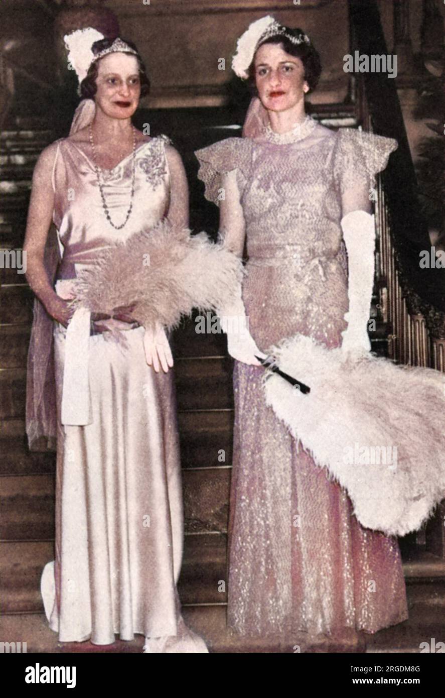 Lady Willoughby de Eresby and Mrs Ronald Tree (better known as Nancy Lancaster), billed in The Tatler as M.P.'s wives on their presentation at court at Buckingham Palace. Nancy Lancaster (1897 - 1994), nee Perkins, was an influential American-born tastemaker, interior decorator and garden designer. She married Ronald Tree in 1920, moving to Britain in 1927; the couple divorced in 1947 and she married Claude Lancaster in 1948. She was associated with the English Country House Style. Stock Photo