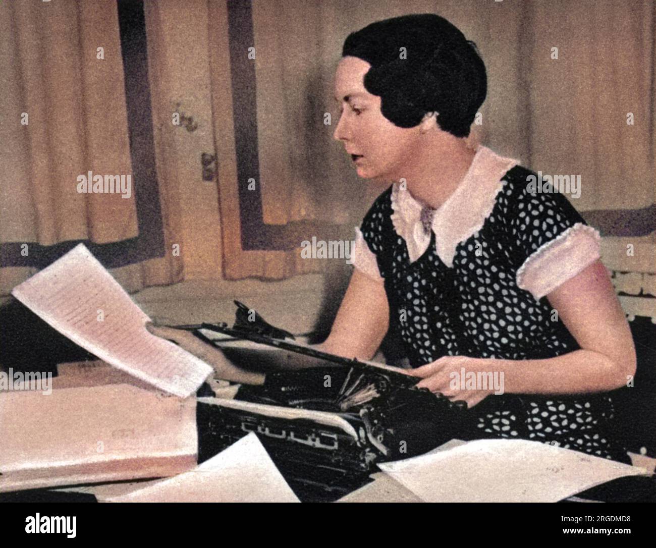 Margaret Mitchell (1900-1949), American author best known for 'Gone with the Wind', pictured hard at work at her typewriter. Stock Photo