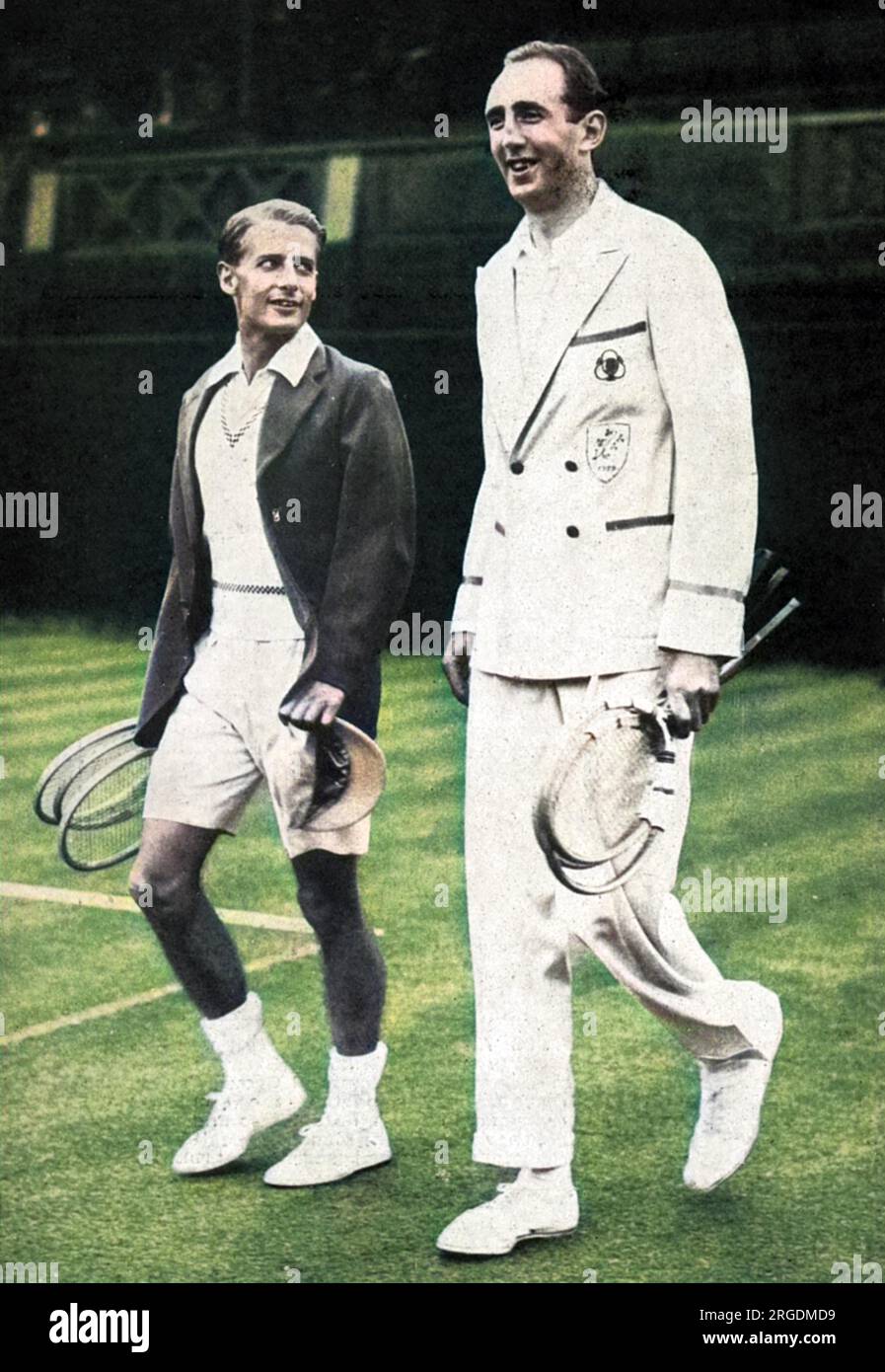 Henry Wilfred 'Bunny' Austin (1906-2000), looks up at the towering frame of his 6 ft 7 inche opponent, Lyttelton Rogers of Ireland, coming out to play the first match at Wimbledon in the Coronation Year Lawn Tennis Championships.  Austin won the four-set match, 3-6, 8-6, 6-1, 6-2. Stock Photo