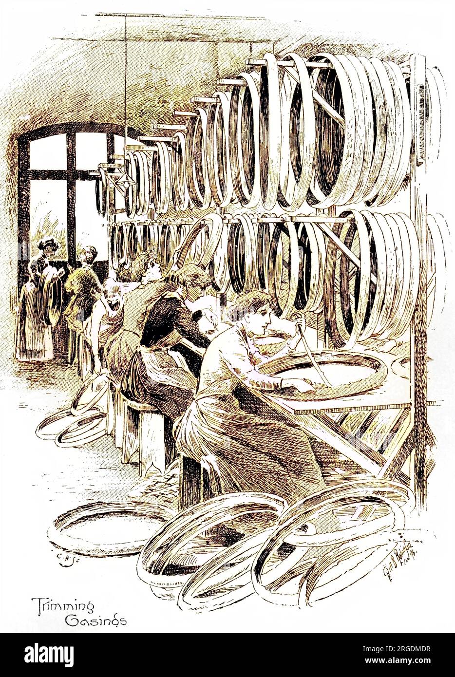 Manufacture of cycling accessories: women trimming the casings of Dunlop tyres. Stock Photo