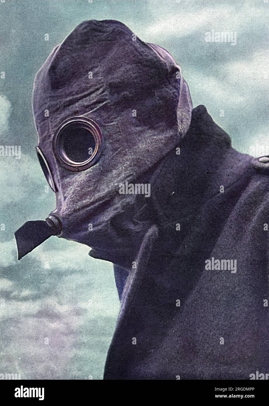 A 'fearsome-looking gas helmet'.  An example of a gas mask issued to British soldiers during the First World War.  The peculiar projection in front has its termination in the mouth so that the wearer inhales through the nose and exhales through the mouth and projecting tube, thereby avoiding condensation on the glasses of the goggles. Stock Photo