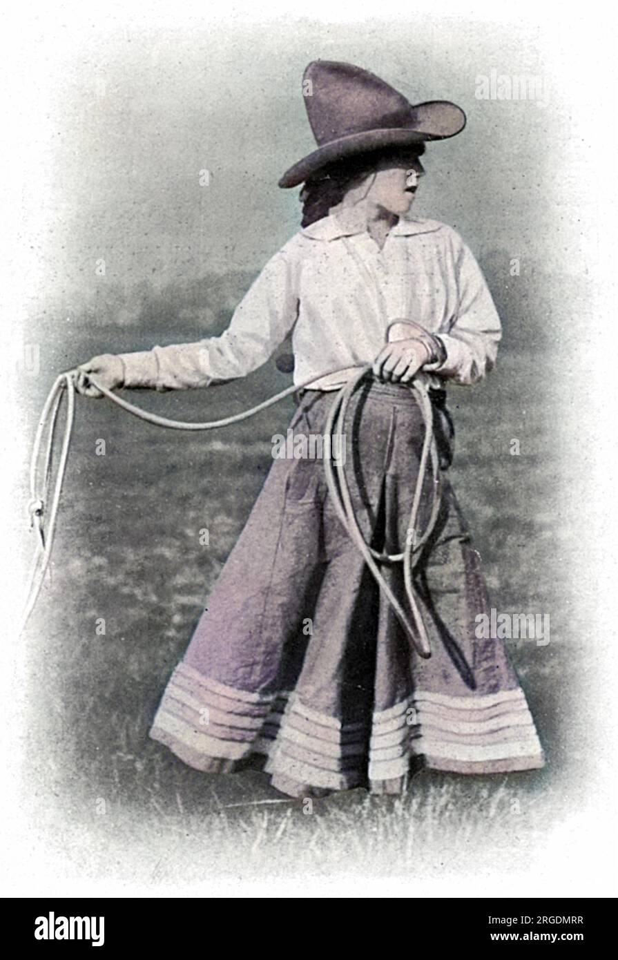 A war worker, Miss Poppette Ginnette, who was formerly a circus rider, seen with a lasso, in her role helping her father break in Army horses in  London suburb during the First World War. Stock Photo