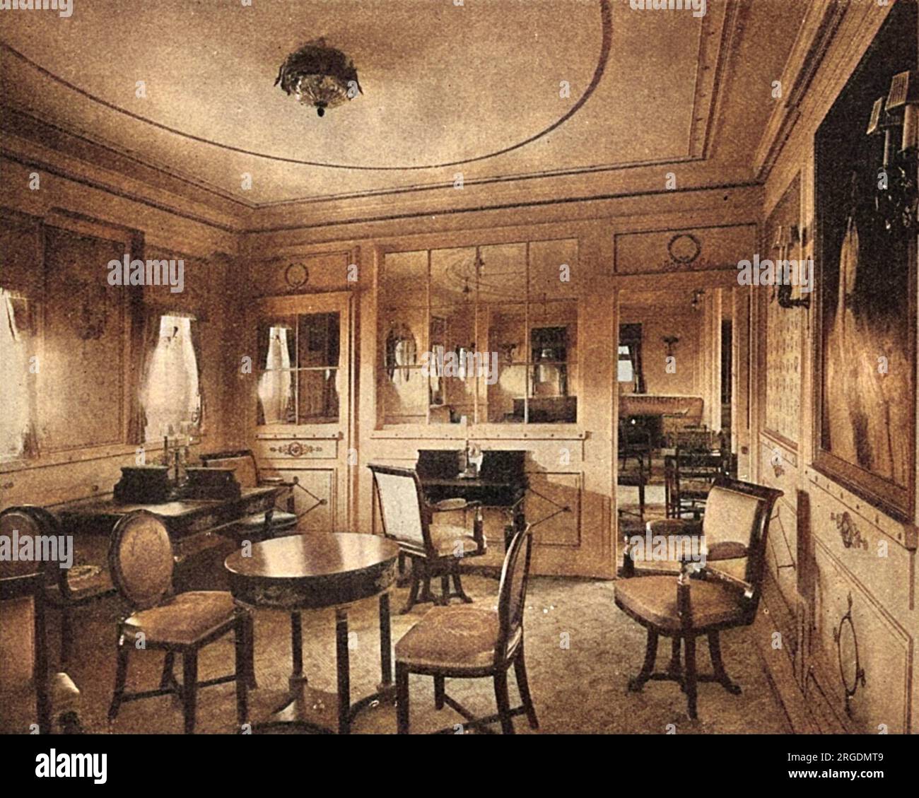 The luxurious writing room of the German steamship 'Amerika' of the Hamburg-America Line, as decorated in the Empire style by Waring and Gillow Limited. Pictured here in the year she was launched, in 1917 the Amerika would become USS America, following being commandeered by the Americans when they entered World War One. Stock Photo