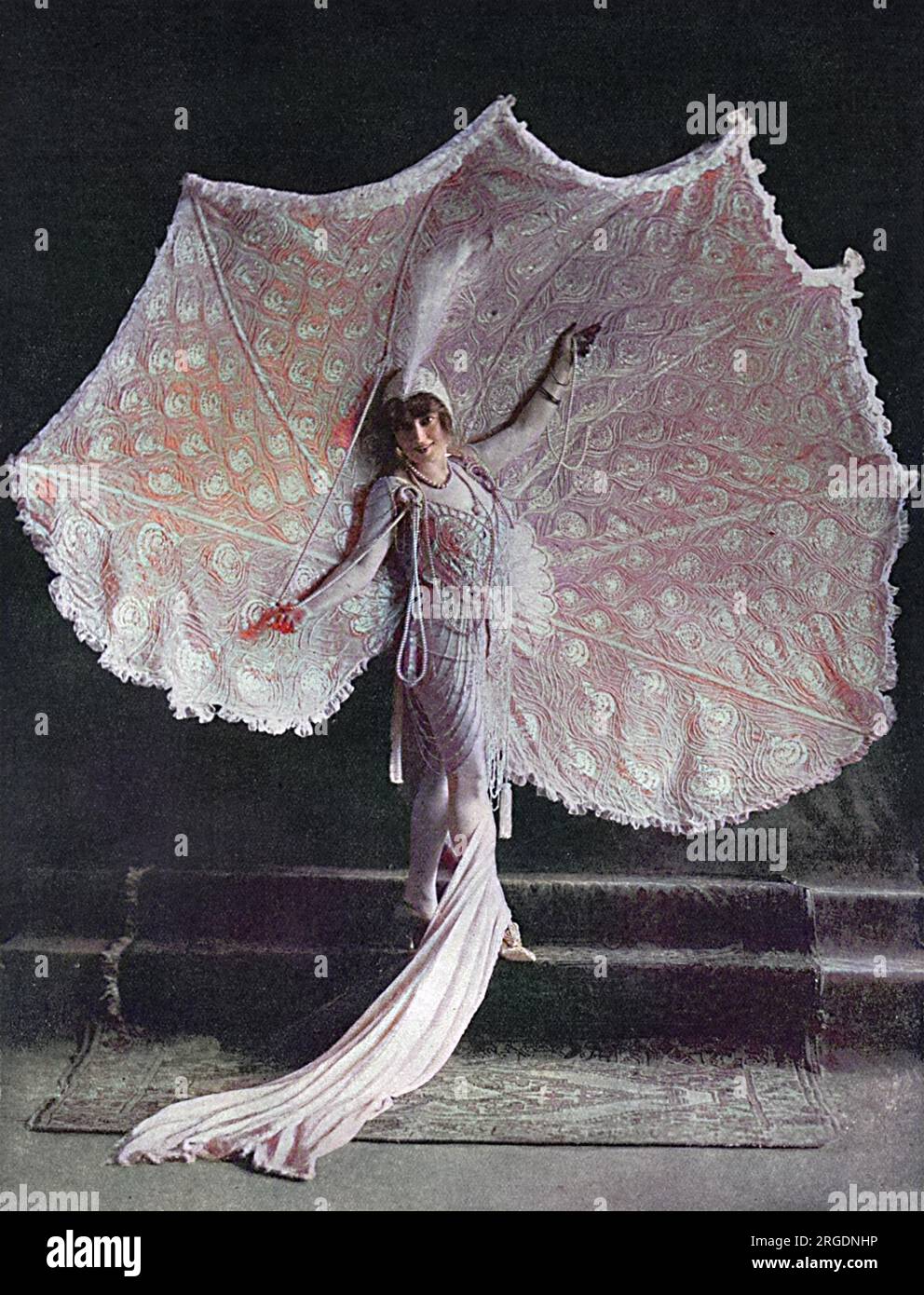 Miss Anna Held, appearing in 'Follow Me' at the Casino in New York, displaying her spectacular peacock gown with the 'tail spread'. Stock Photo