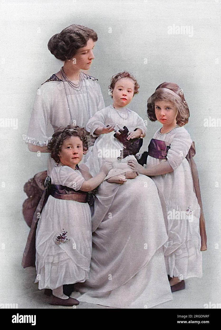 Lady Ingestre, formerly Lady Winifred Paget, widow of the late Lord Ingestre who died in 1915 and was a captain in the Blues, pictured with her three daughters; the Hon. Ursula, Victoria and Joan, born 1907, 1910 and 1911 respectively. Of her four children, the youngest succeeded to the title of Earl of Shrewsbury.  A memorial service for the late Viscount Ingestre was held at the Chapel Royal, St. James's on 13 January 1915. Stock Photo