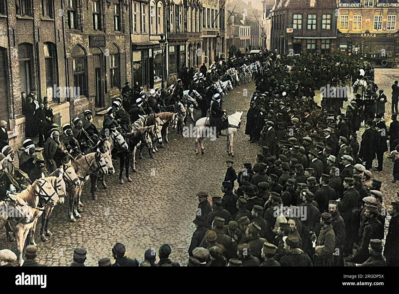 French Algerian cavalry - spahis drawn up in the market square at Furnes, West Flanders, Belgium, November 1914. Belgian people taking a keen interest. Stock Photo