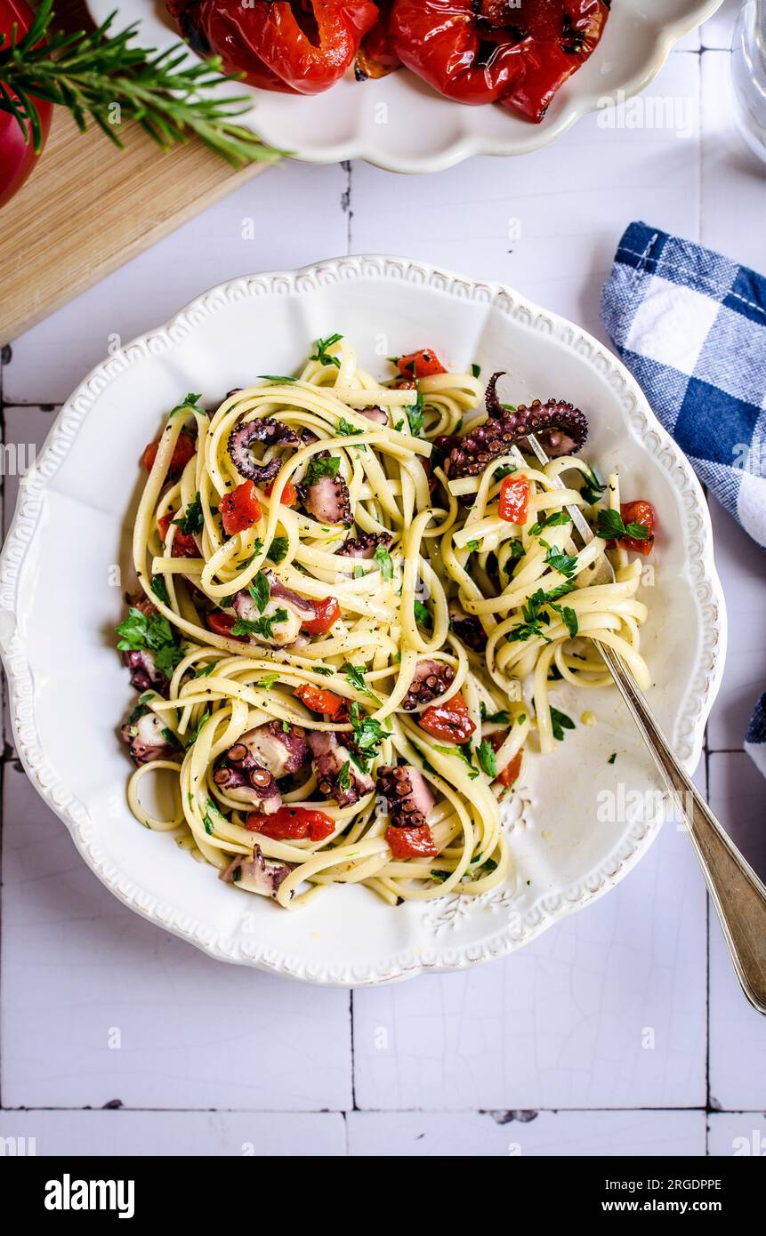 Pasta with octopus and red pepper Stock Photo
