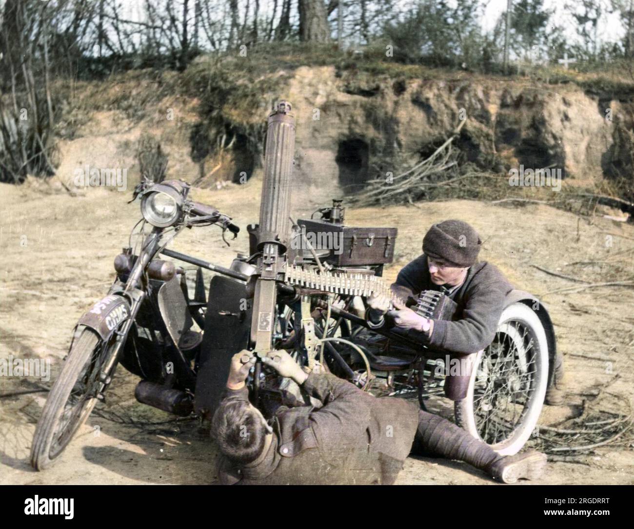 Two men belonging to a Motorcycle Machine Gun Unit with a Scott motorcycle during the First World War, using a Vickers machine gun to fire at aircraft. Stock Photo