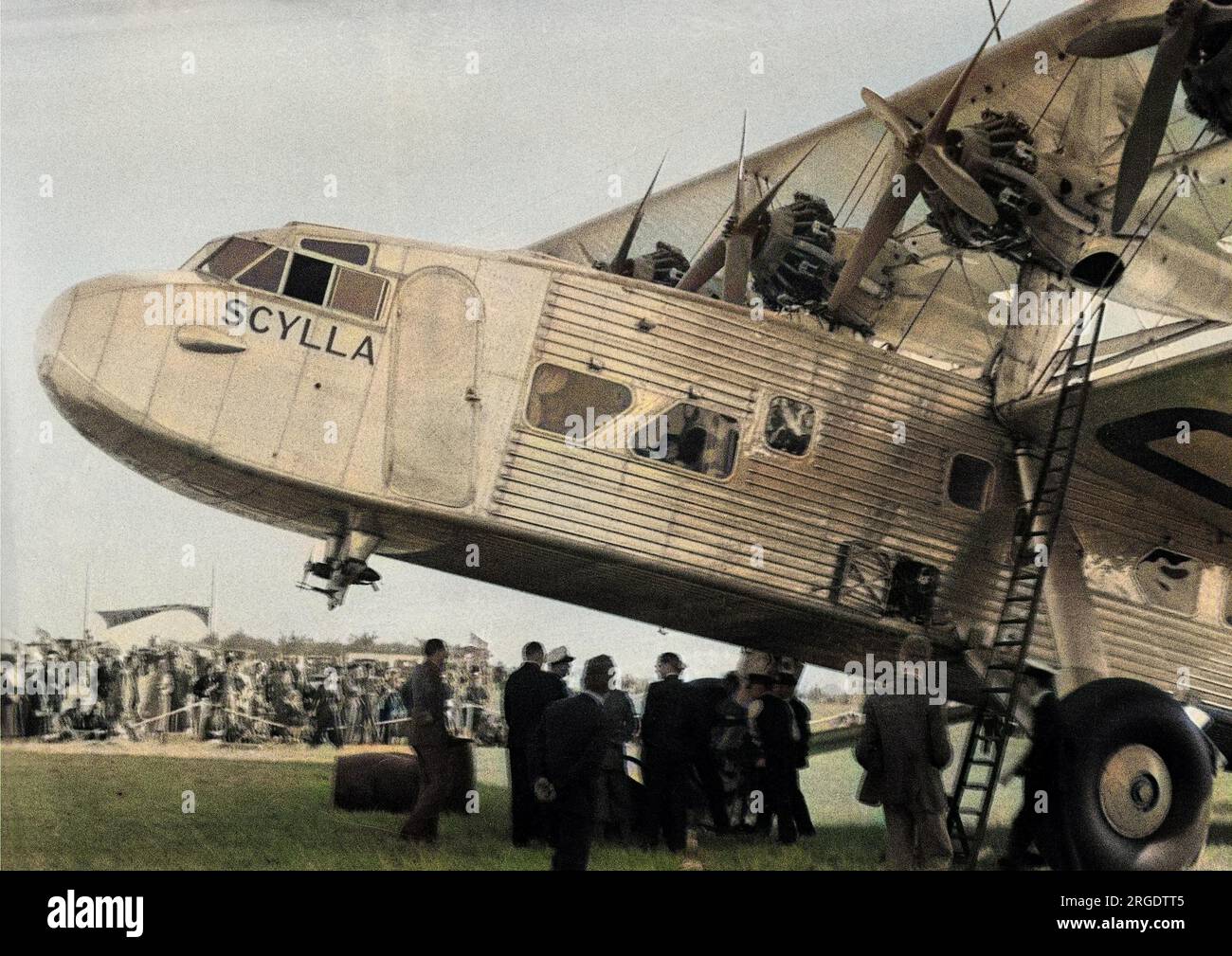 The Scylla L17 British four-engine biplane, designed and built by Short Brothers. It was used by Imperial Airways for scheduled flights between London and various European cities. Seen here on an airfield with a large crowd of people. Stock Photo