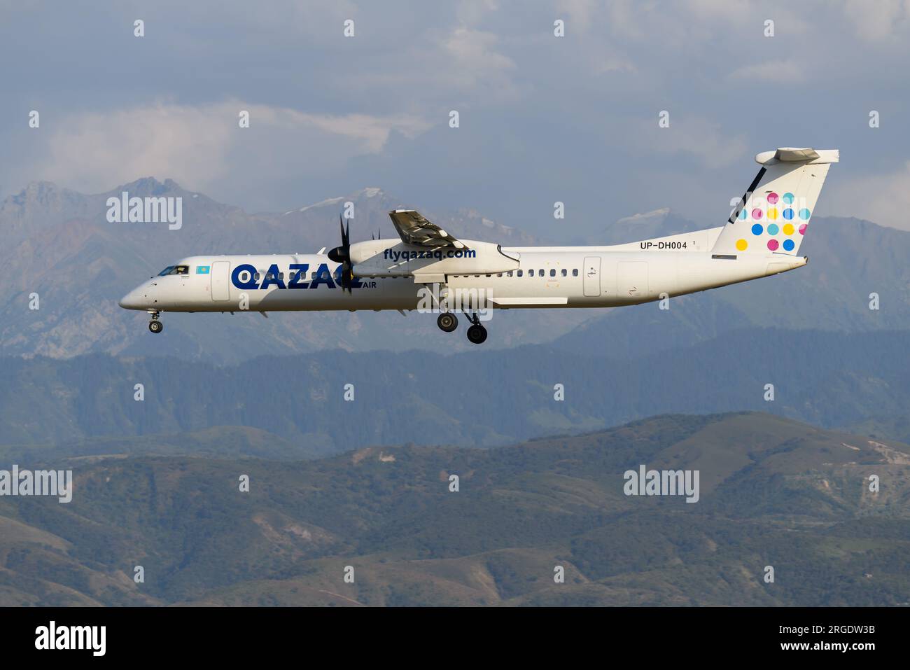 Qazar Air De Havilland Canada Dash 8-400 airplane landing at Almaty Airport in Kazakhstan. Airline QazarAir Bombardier Q400 aircraft. Stock Photo