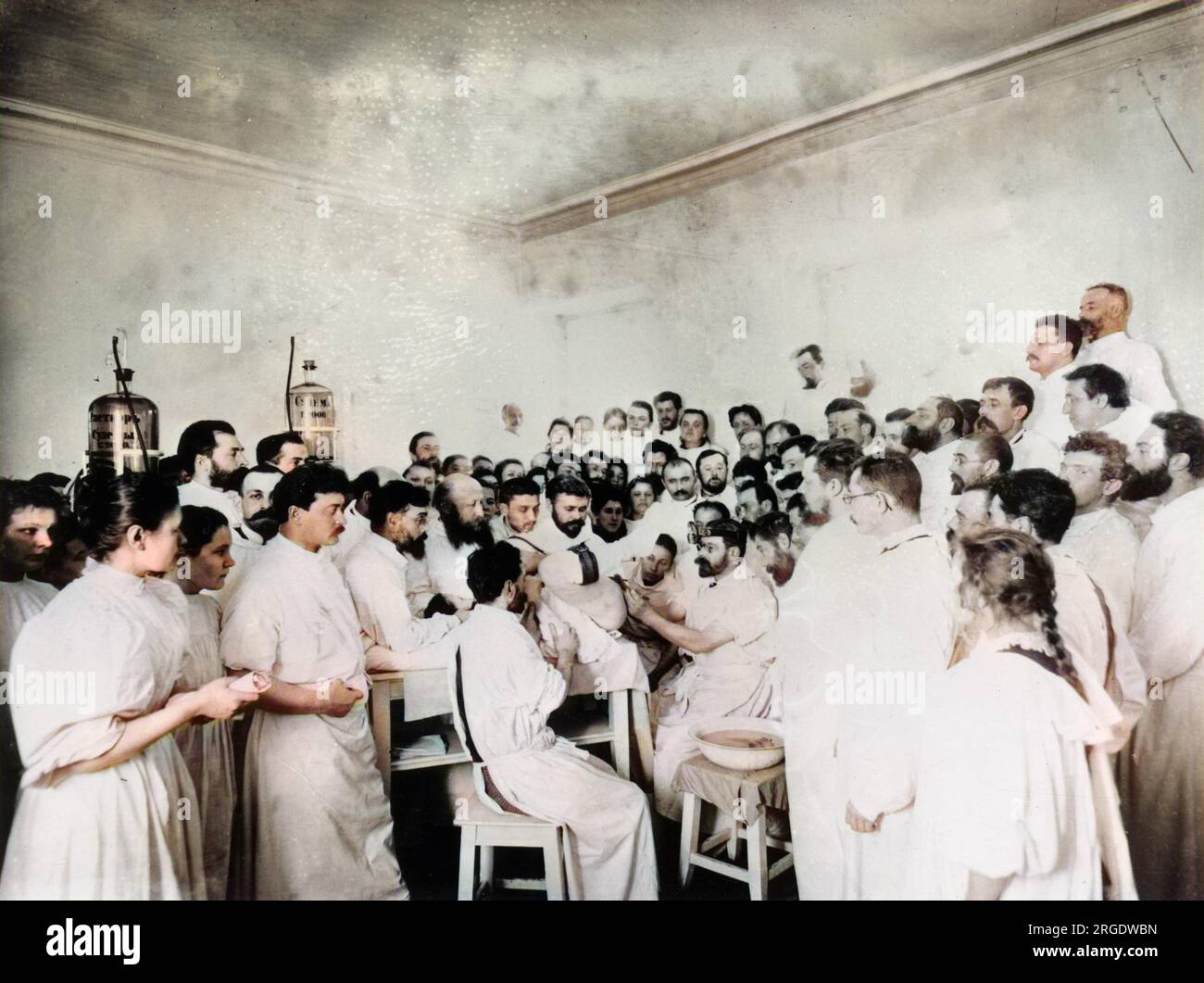 Early 20th century Gynaecological surgery taking place in front of a vast audience of Surgeons, would-be surgeons and nurses in the Obstetric Institute in St Petersburg, Russia. Stock Photo