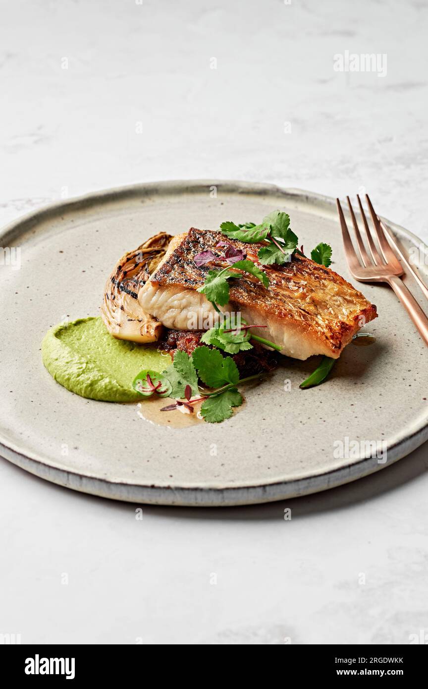 Barramundi fish, leek puree, seafood XO sauce, braised witlof, charred