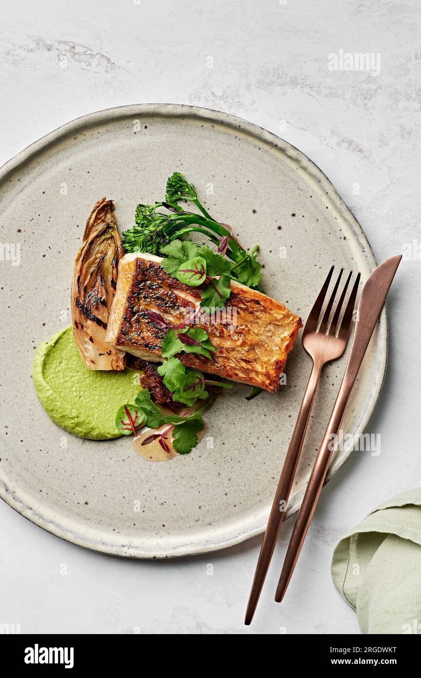 Barramundi fish, leek puree, seafood XO sauce, braised witlof, charred