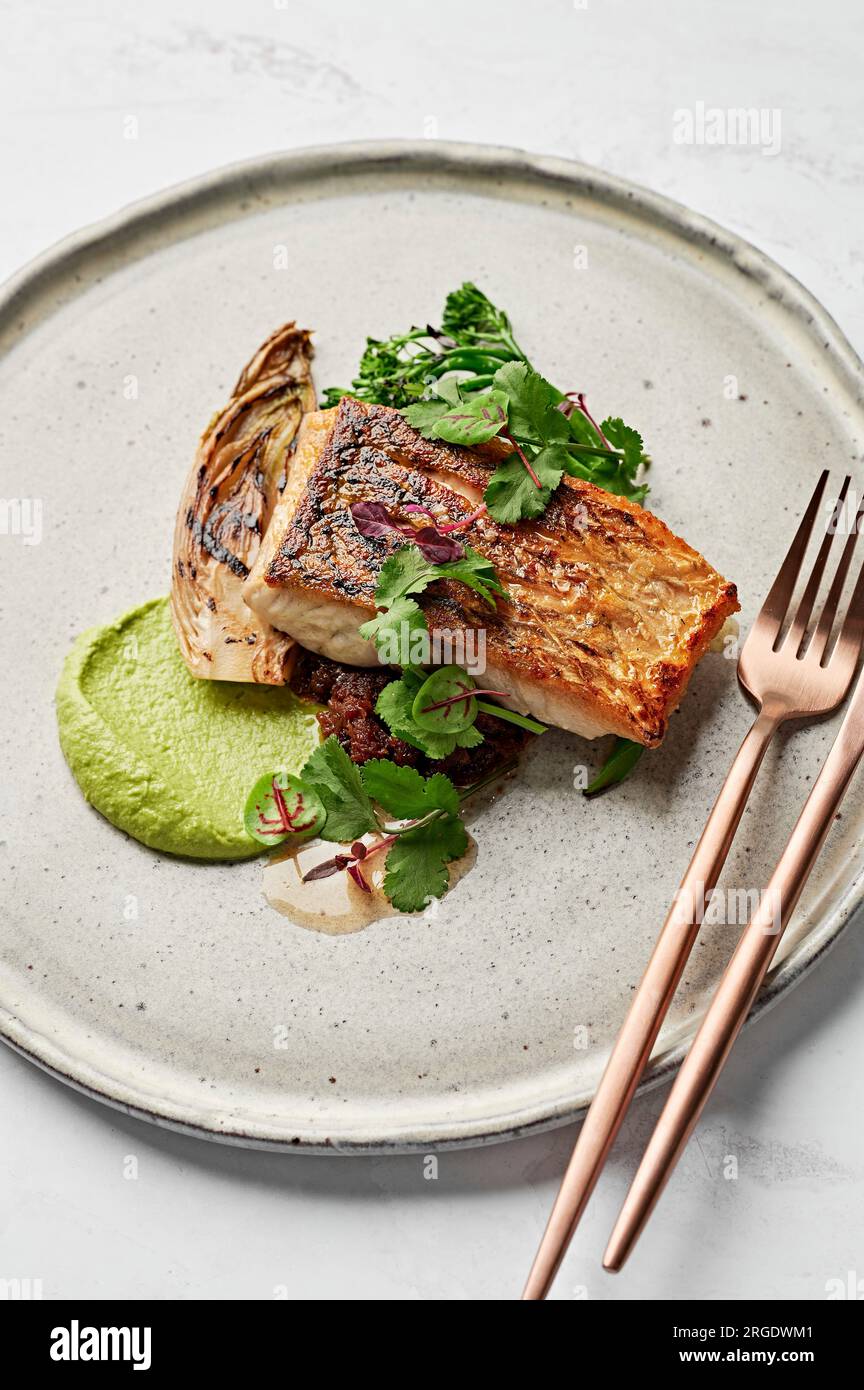 Barramundi fish, leek puree, seafood XO sauce, braised witlof, charred