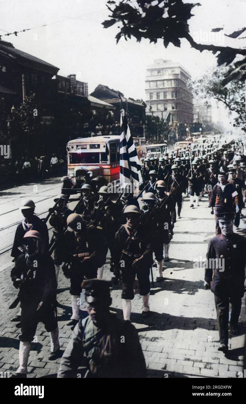 Japanese troops march through Osaka before their departure for the front during the war with China Stock Photo