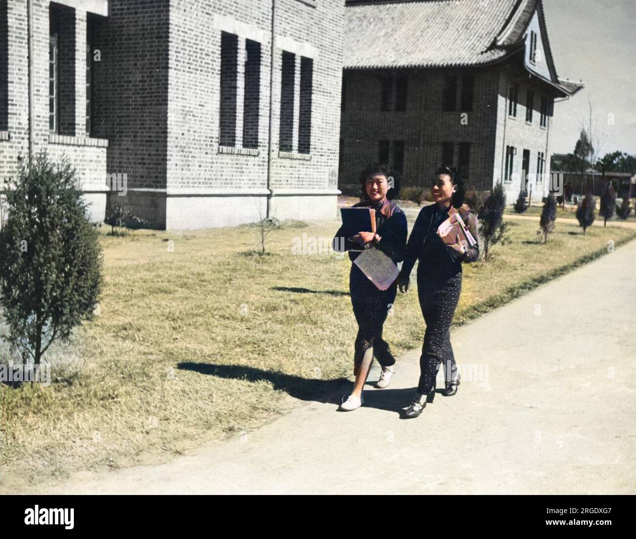 Two female Chinese students at the Southwest Associated University in Kunming. The University had its origins in the local agricultural college, and was established for students whose studies at Beijing and Tientsin were interrupted by the Japanese invasion. Stock Photo