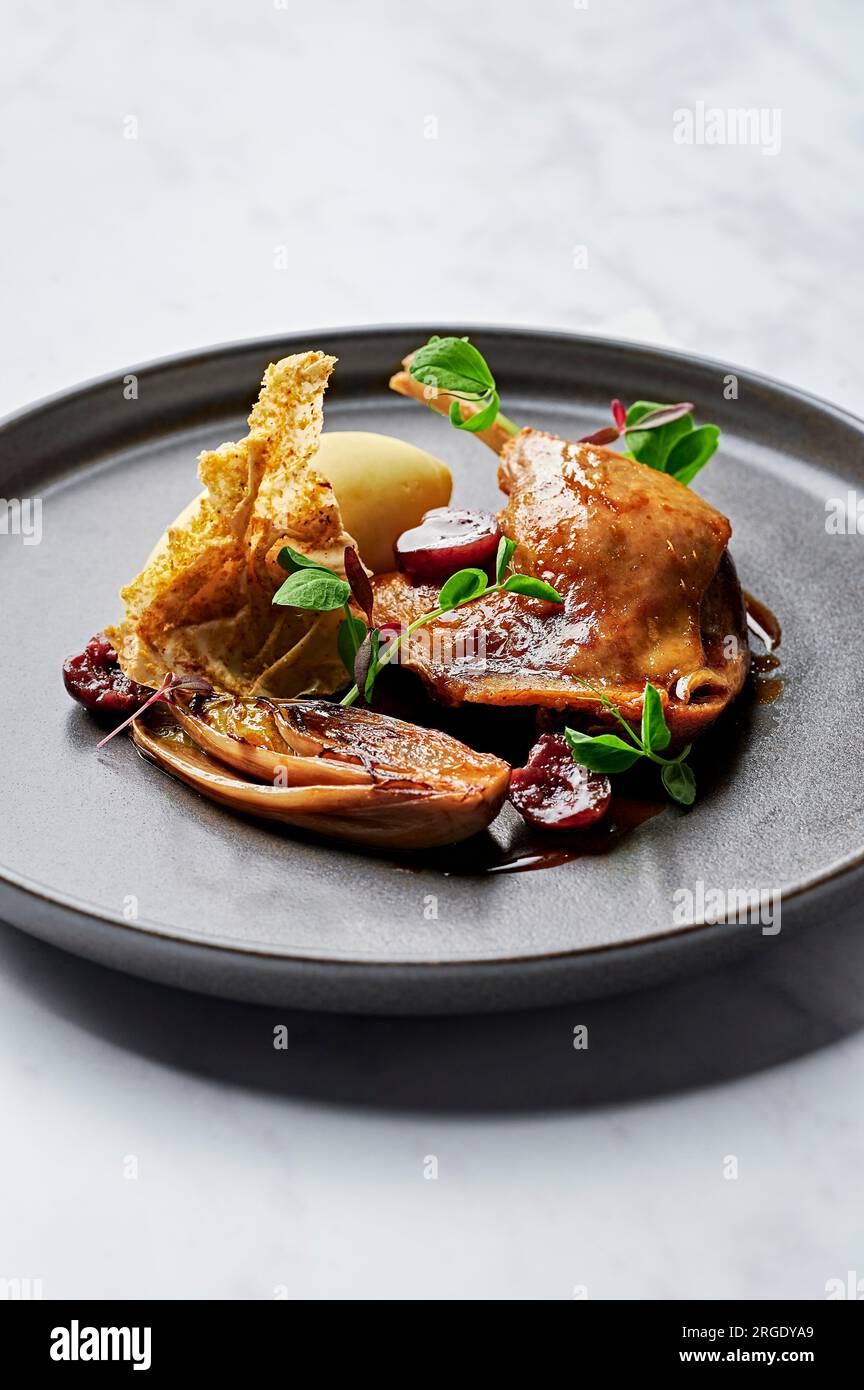 Confit duck leg, creamy mash, caramelised witlof, sour cherry jus