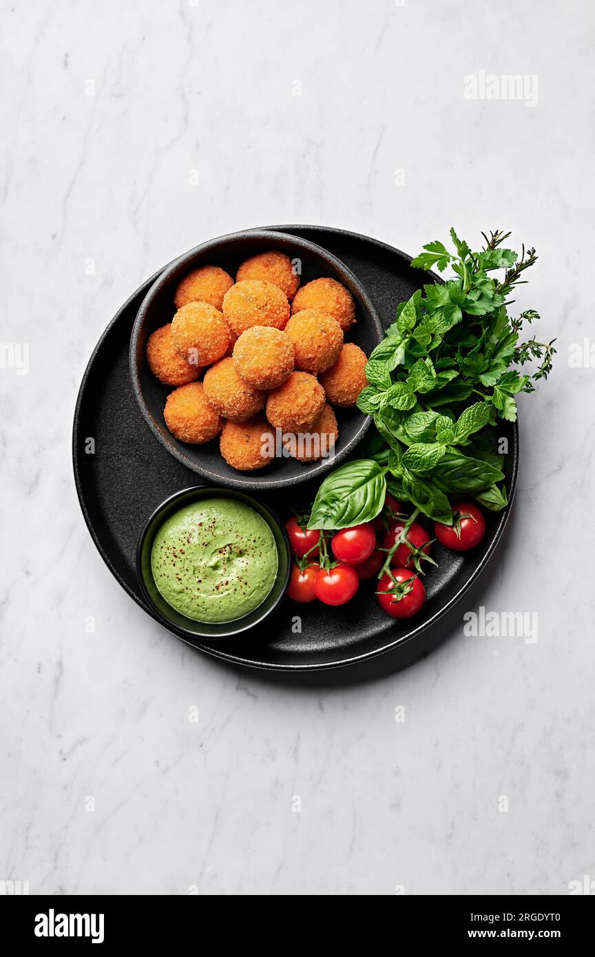 Tomato, basil and cheese arancini with green goddess aioli from above