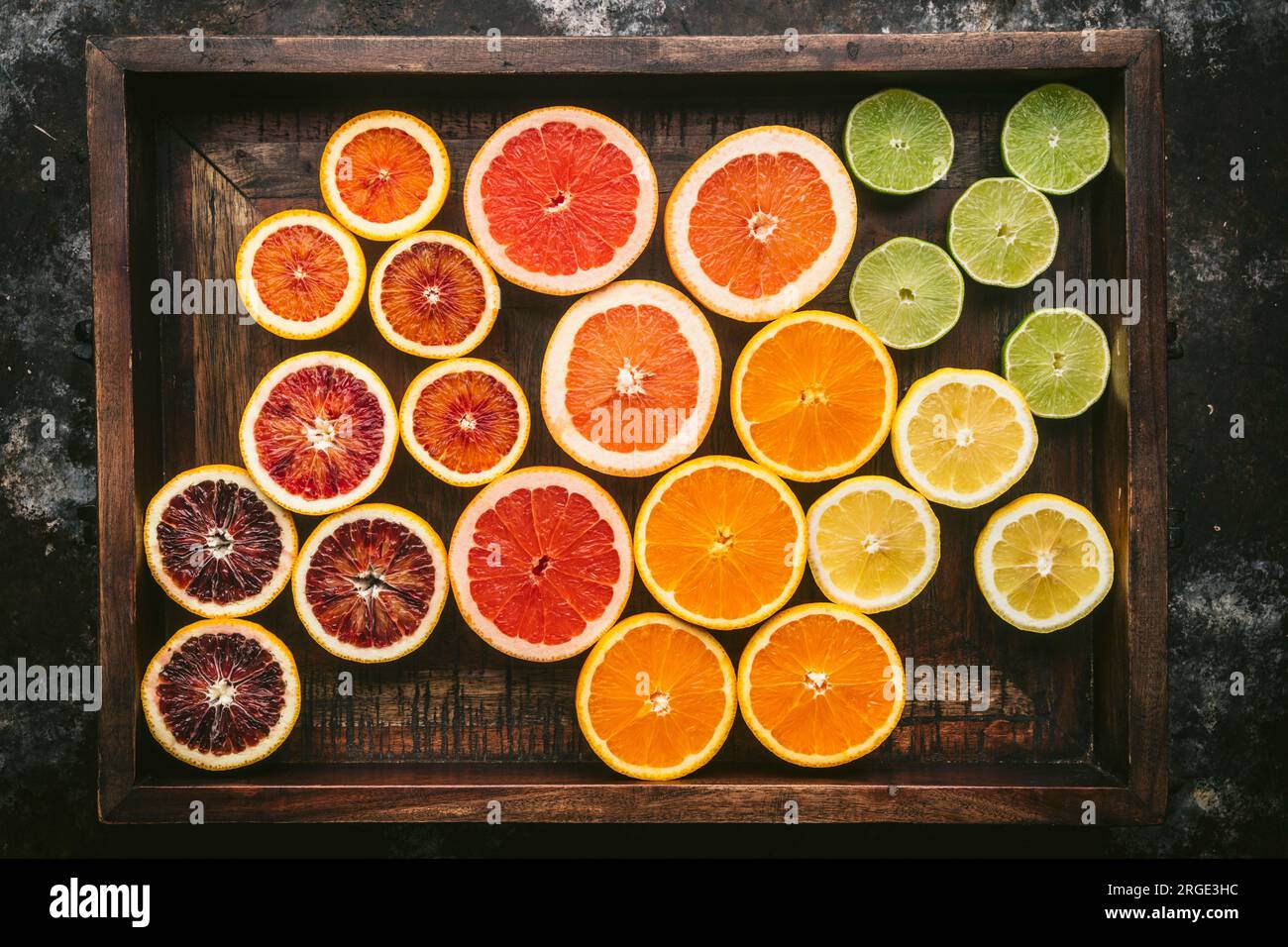 Fresh citrus fruits cut in half showing vibrant flesh