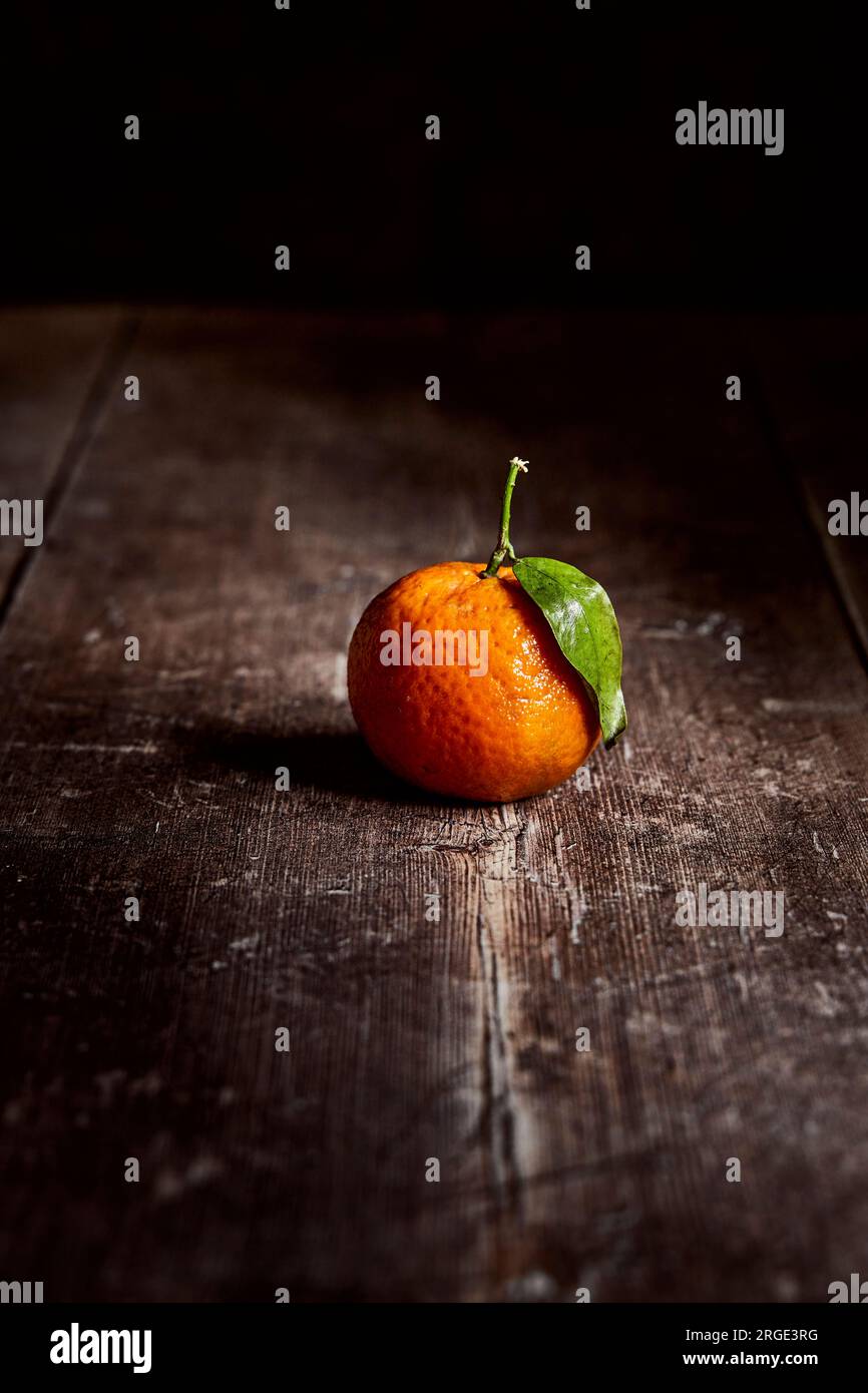 Clementines on a wooden table Stock Photo