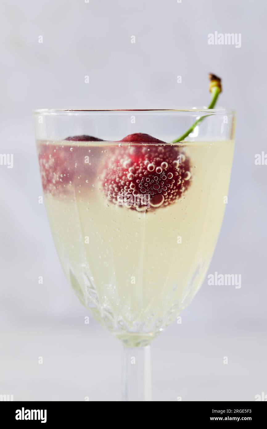 Lemon sparkling water with cherries Stock Photo
