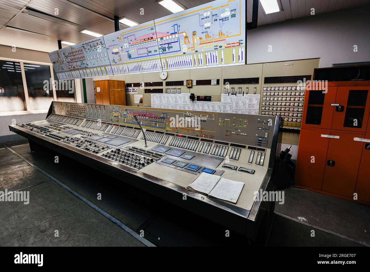 Control room. Large Industrial control panel inside factory or power plant. Stock Photo