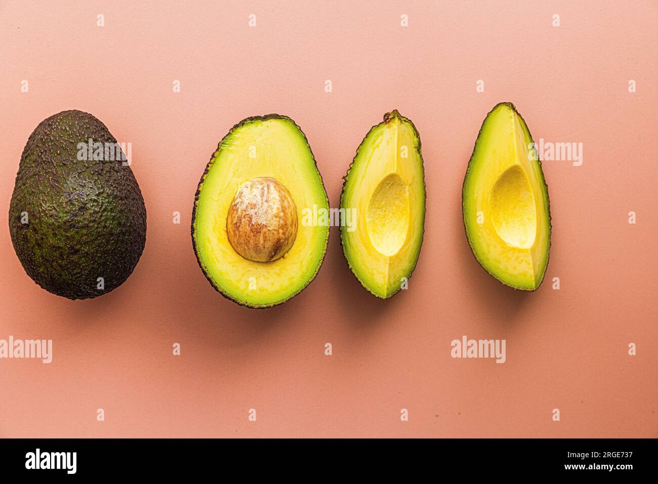 Sliced avocado on a plain background Stock Photo