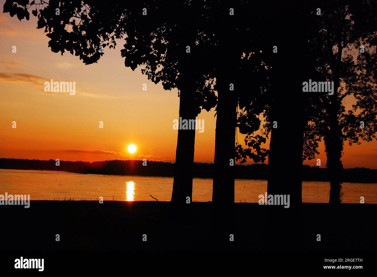 The sunsets along the Mississippi River at a riverfront park near Memphis, Tennessee Stock Photo