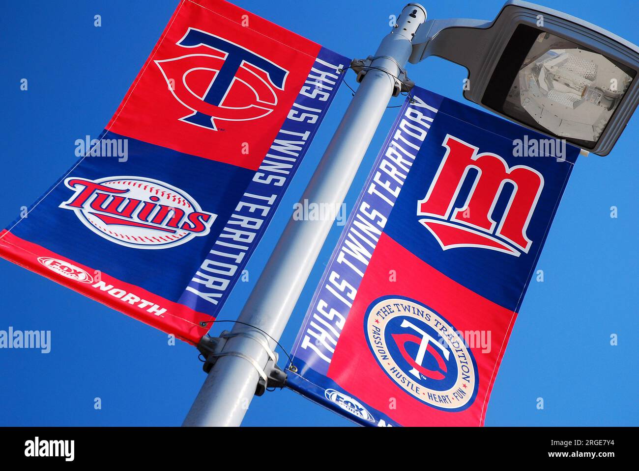 A banner outside Target Field reminds fans of their favorite team and shows the history o the Minnesota Twins team logos Stock Photo