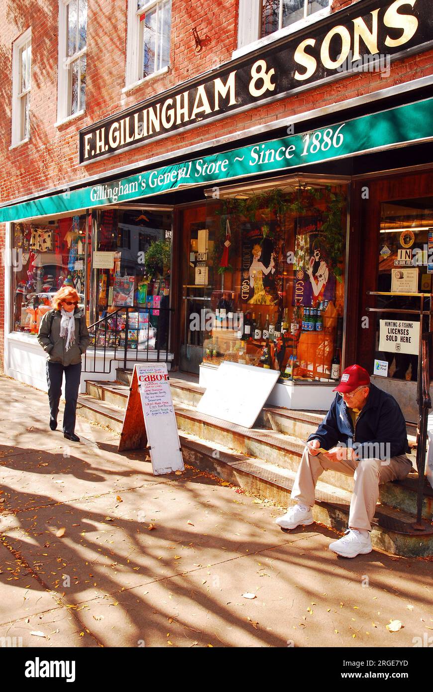A senior man waits for the rest of his friends outside a general store ...