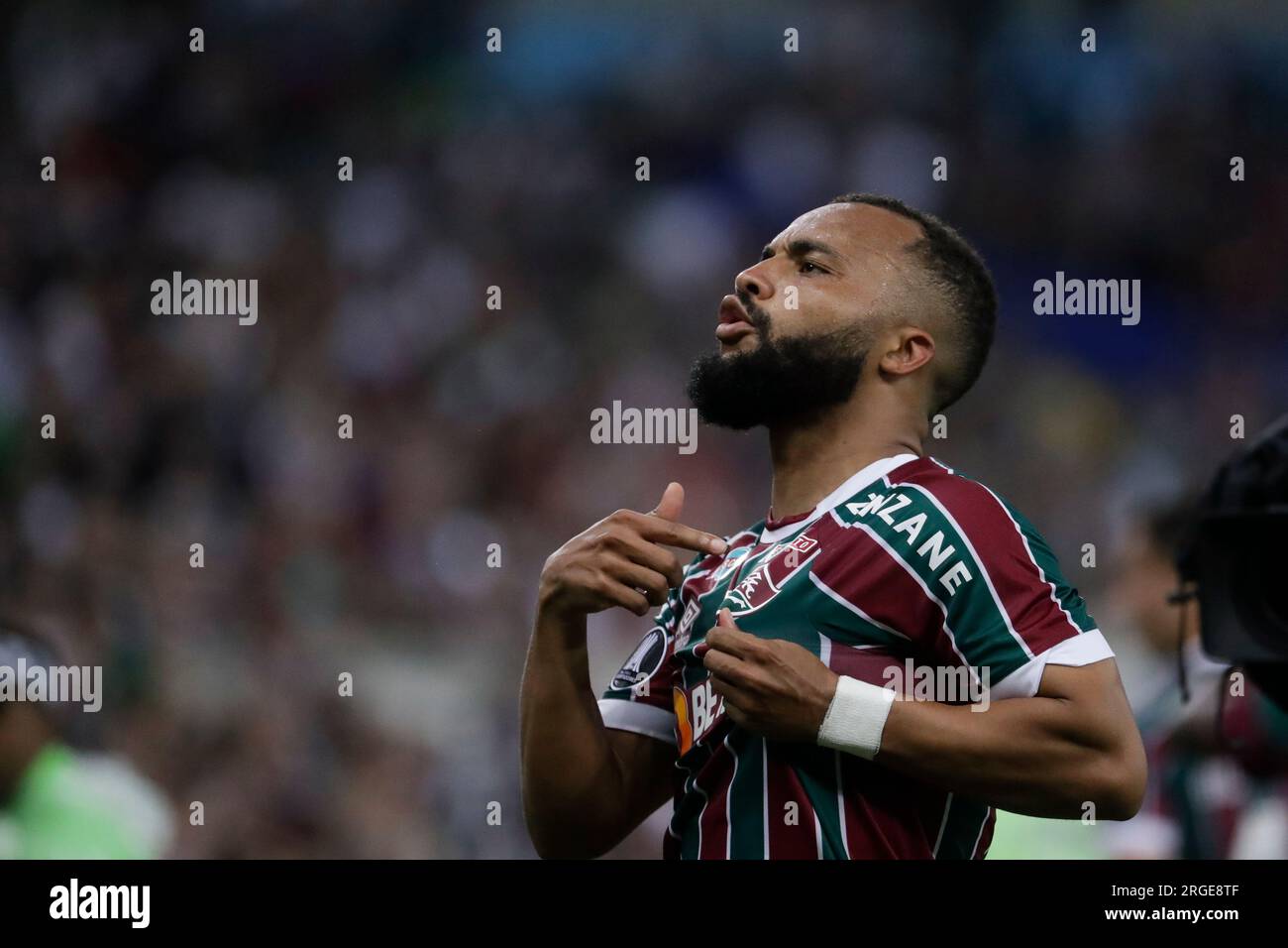 Samuel Xavier of Brazil's Fluminense, center, and Rene of Brazil's  Internacional head the ball during a Copa Libertadores semifinal second leg  soccer match at Beira Rio stadium in Porto Alegre, Brazil, Wednesday