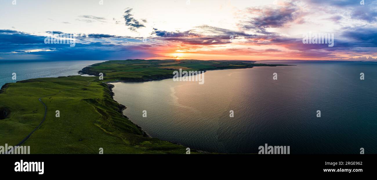 Sunset over Mull of Galloway Lighthouse from a drone, Mainland Scotland, UK Stock Photo