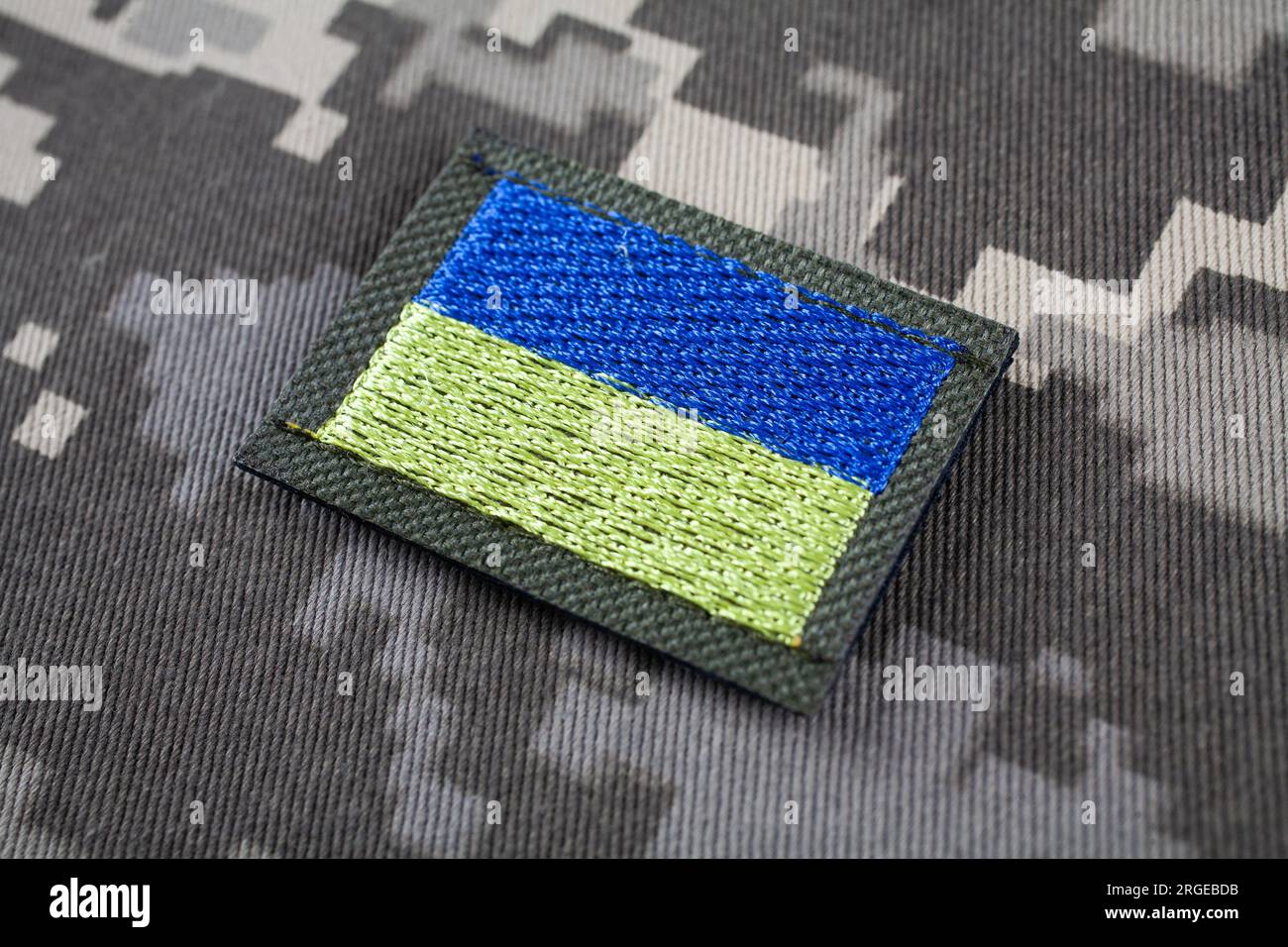 KYIV, UKRAINE - October 5, 2022. Russian invasion in Ukraine 2022. Ukraine Army Flag Patch uniform shoulder sleeve insignia badge on camouflaged unifo Stock Photo