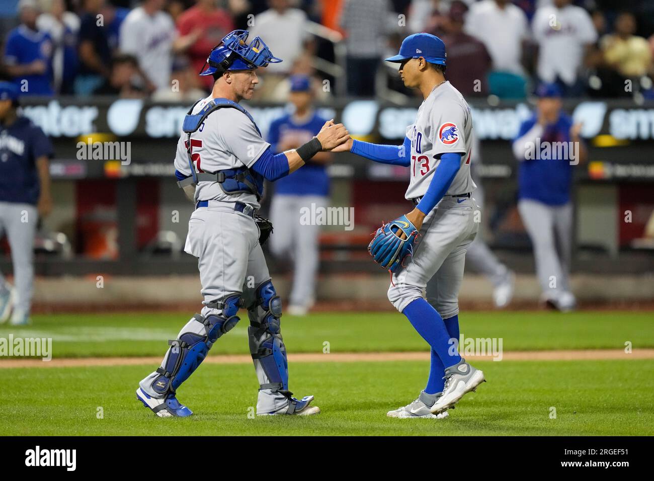 Chicago Cubs relief pitcher Adbert Alzolay (73) and catcher Yan Gomes (15)  celebrate after closing the ninth inning of a baseball game against the New  York Mets, Tuesday, Aug. 8, 2023, in