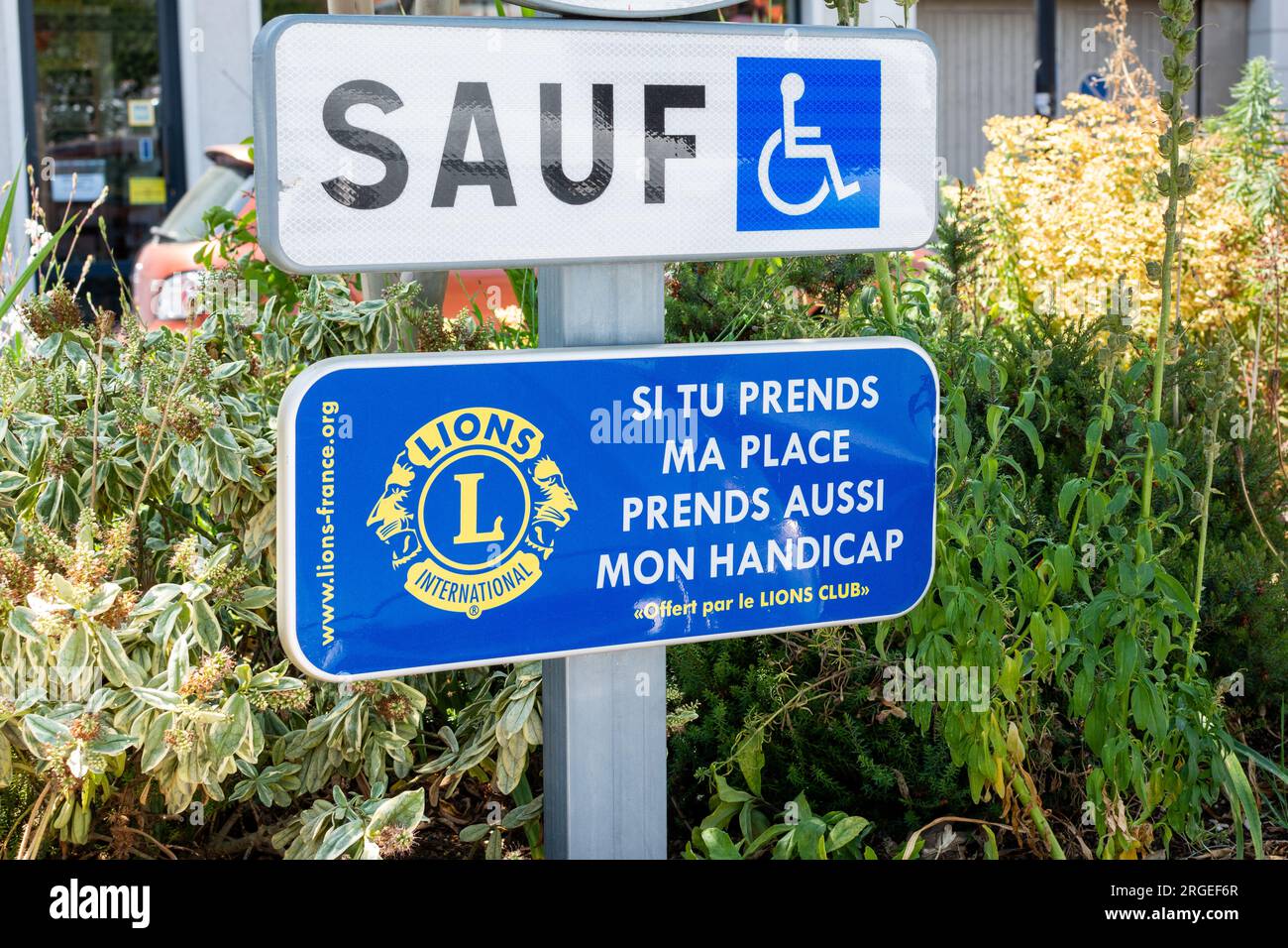 Parking sign reserved for people with disabilities in France Stock Photo