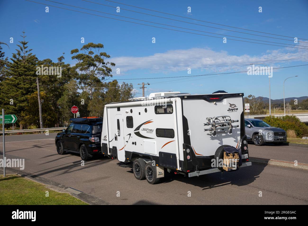 Nissan Patrol towing a Jayco Journey caravan camper van whilst driving