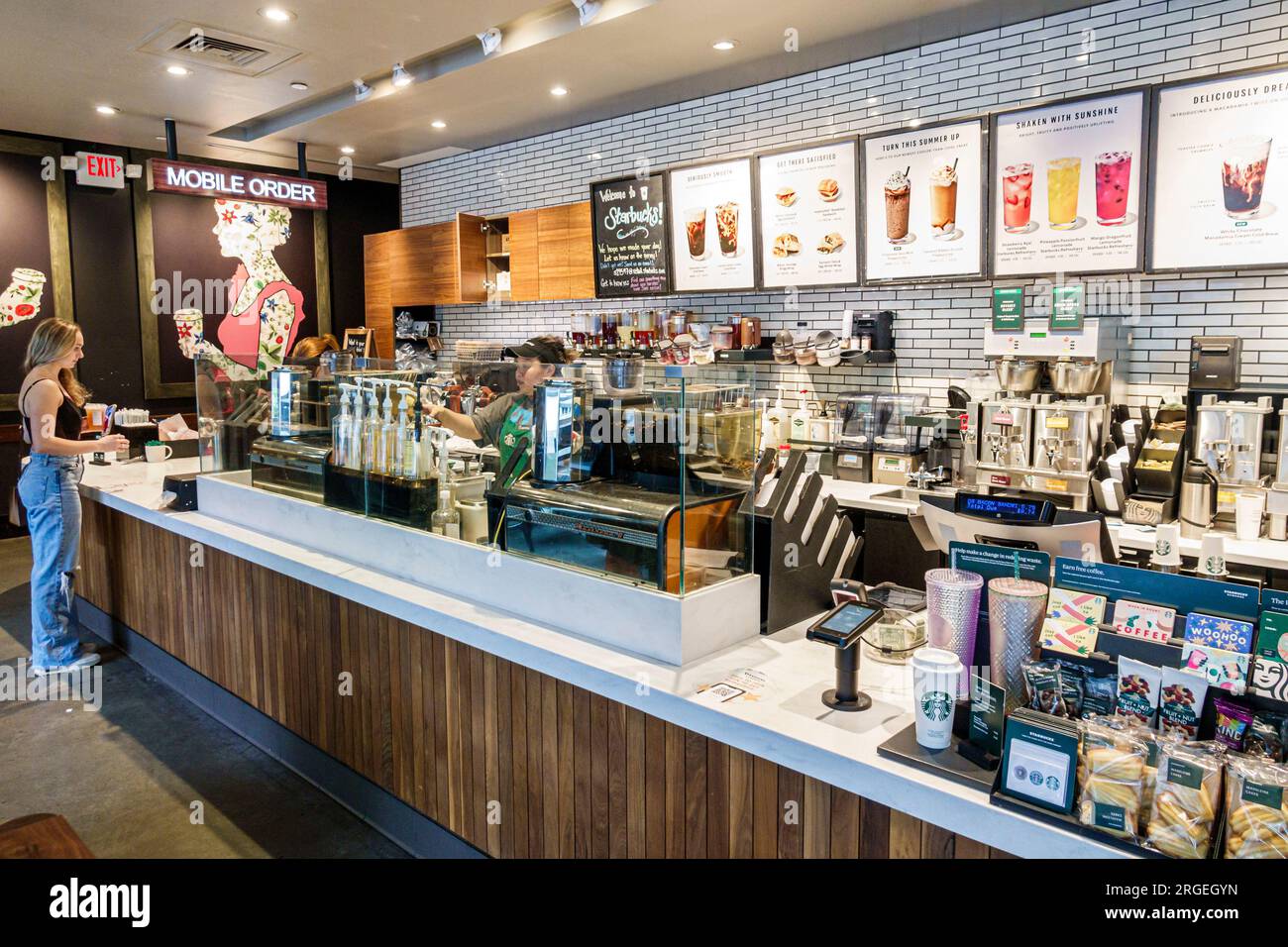 Charlotte North Carolina,Starbucks Coffee,barista taking order,woman women lady female,adult,resident,inside interior indoors,employee worker working Stock Photo