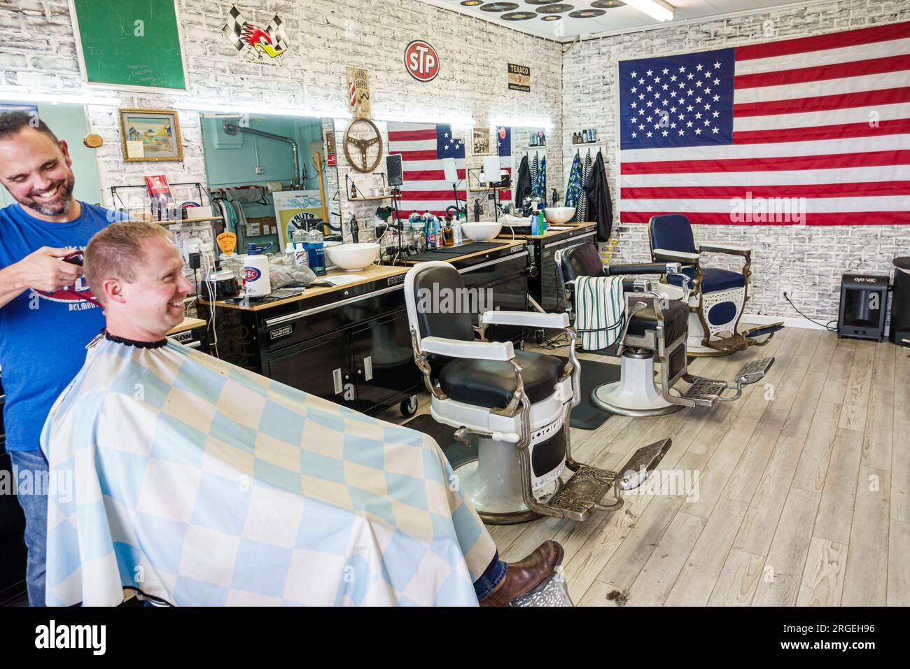 Belmont North Carolina,barber shop customer getting haircut hair cut,chairs American flag,man