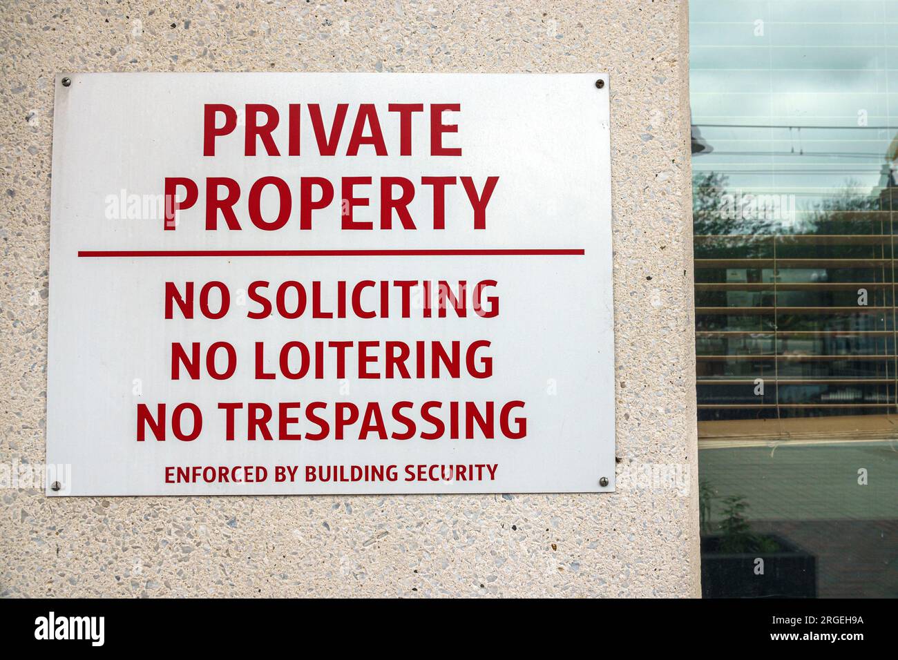 Charlotte North Carolina,generic private property no soliciting loitering trespassing sign,self-driving mobile robot offering free sample Stock Photo