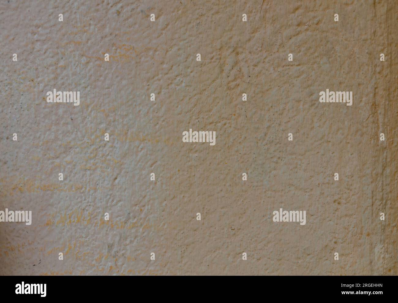 The concrete surface is pale yellow, faded and old. Stock Photo