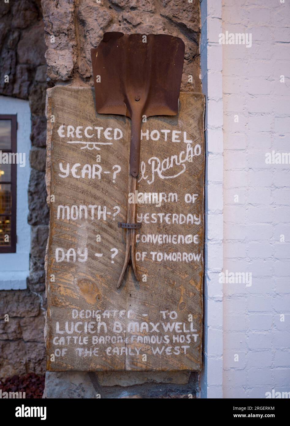 wooden sign and shovel outside El Rancho Hotel in Gallup, NM Stock Photo