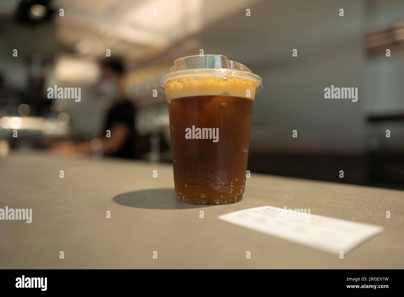Coffee cold brew with tonic served with ice on a grey background. Ready