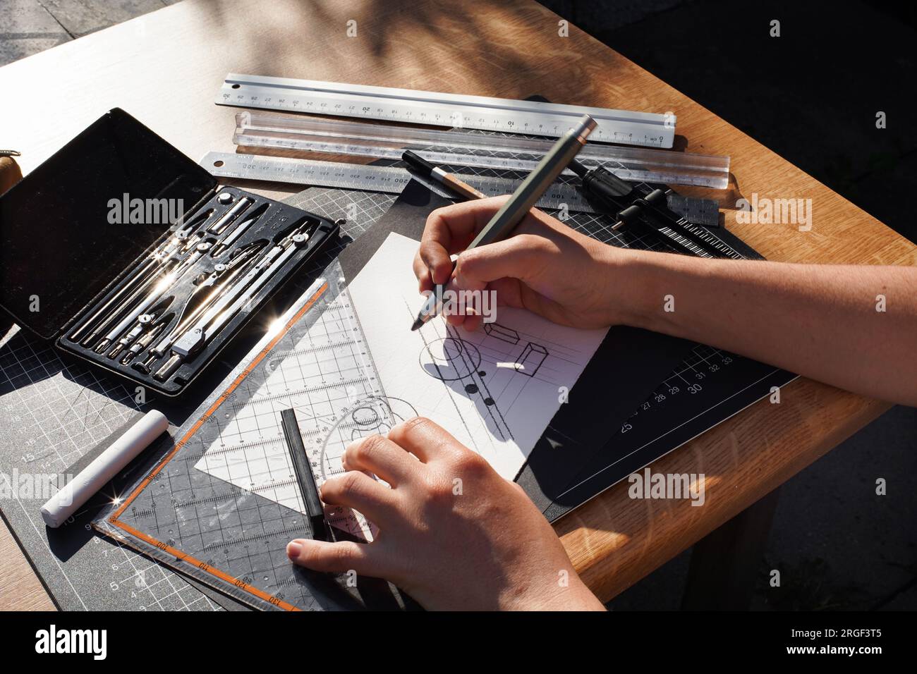 Architect and designer working accurately on a project drawing sketches