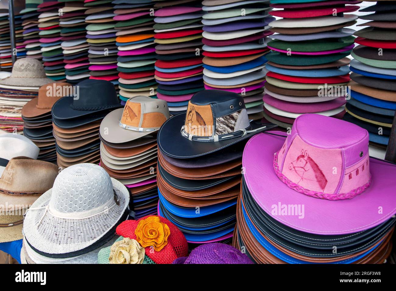 A colourful selection of hats for sale at the Indian market at Otavalo in Ecuador. The market sells a huge range of Indian handicrafts and textiles. Stock Photo